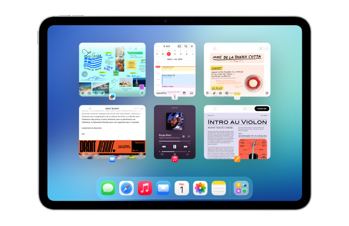 iPad, orientation paysage, l’écran affiche plusieurs apps, dont Calendrier et Musique, disposées côte à côte en six fenêtres alignées sur deux rangées
